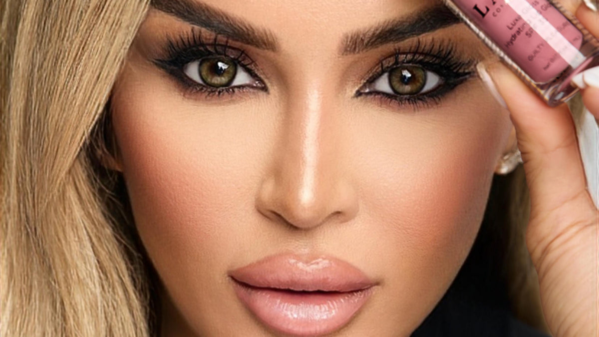 Dr. Laleh Mehrrafiee, DDS, founder of LALE Cosmetics, holding Luxe Gloss