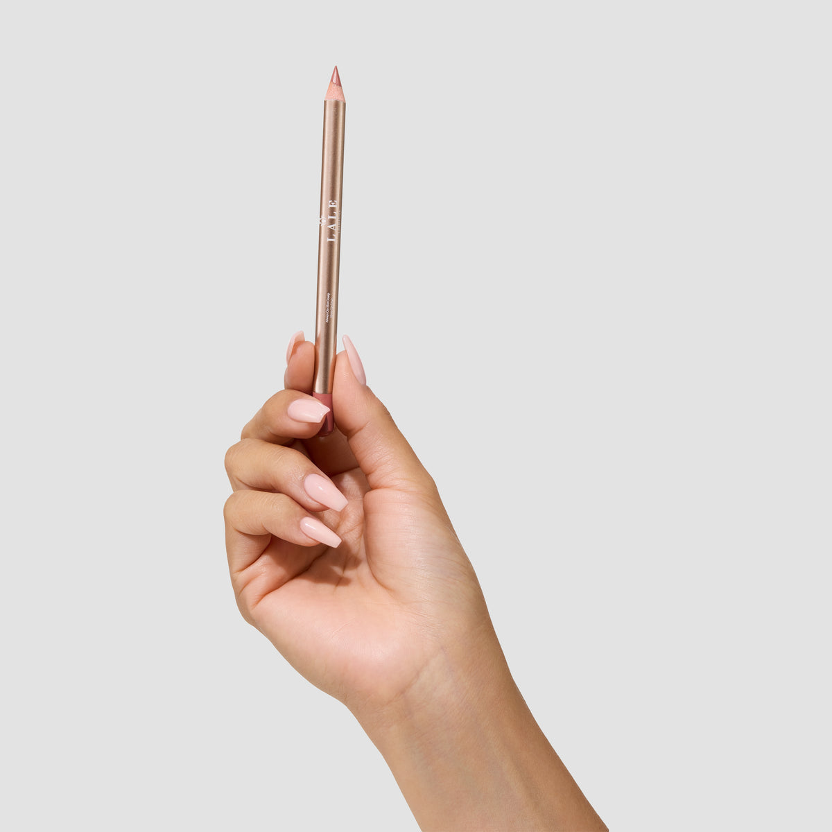 Always On Matte Lip Liner in Hot Gossip held in hand