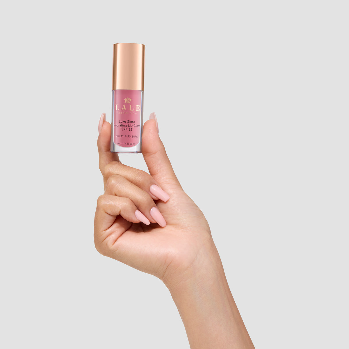 Luxe Gloss in Guilty Pleasure held in hand