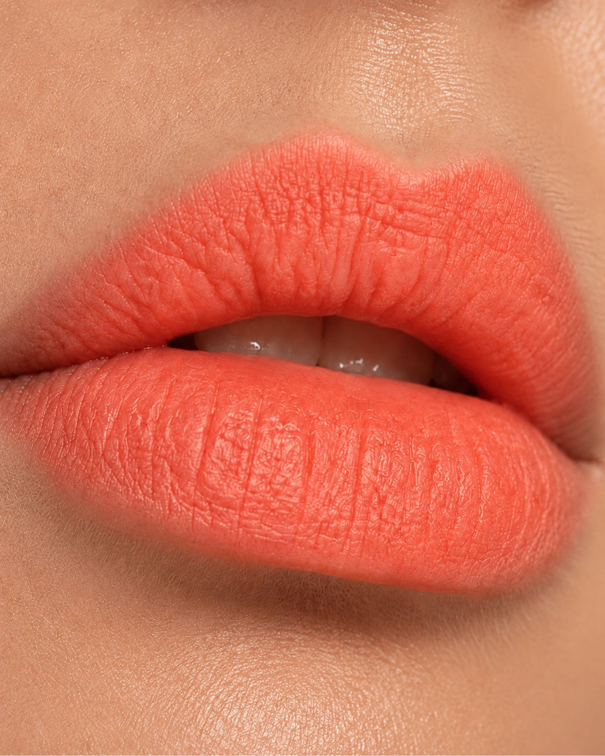 Lips in a warm, orange-based lip color, for comparison
